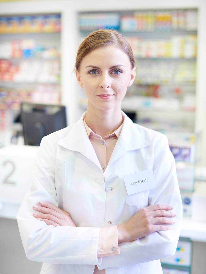 Female pharmacist with folded arms